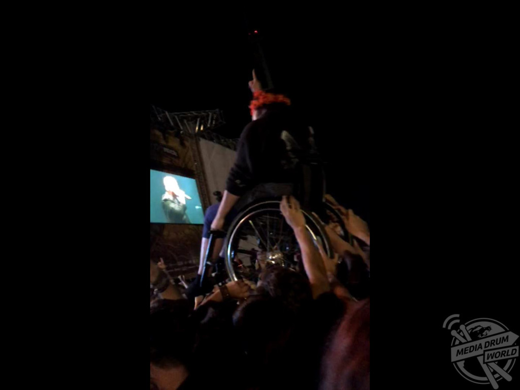 The woman crowd surfing in her wheelchair.