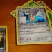 A collection of Pokémon trading cards laid out on a table