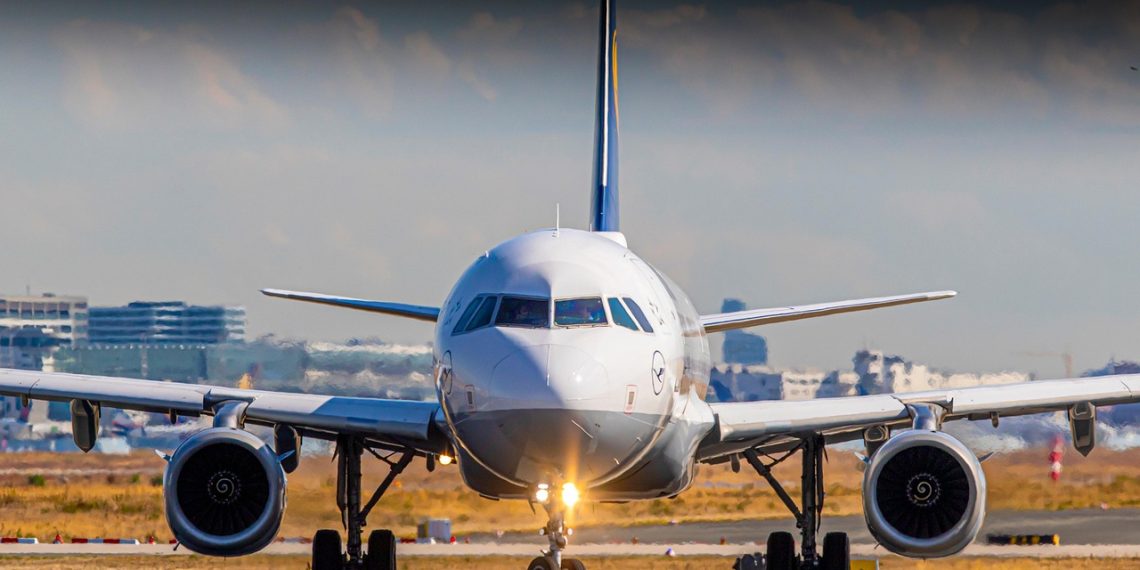 A rocket-powered spaceplane taking off from an airport runway