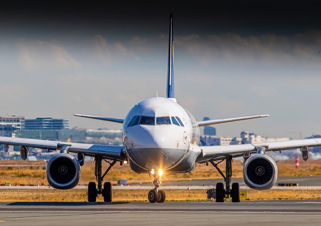 A rocket-powered spaceplane taking off from an airport runway